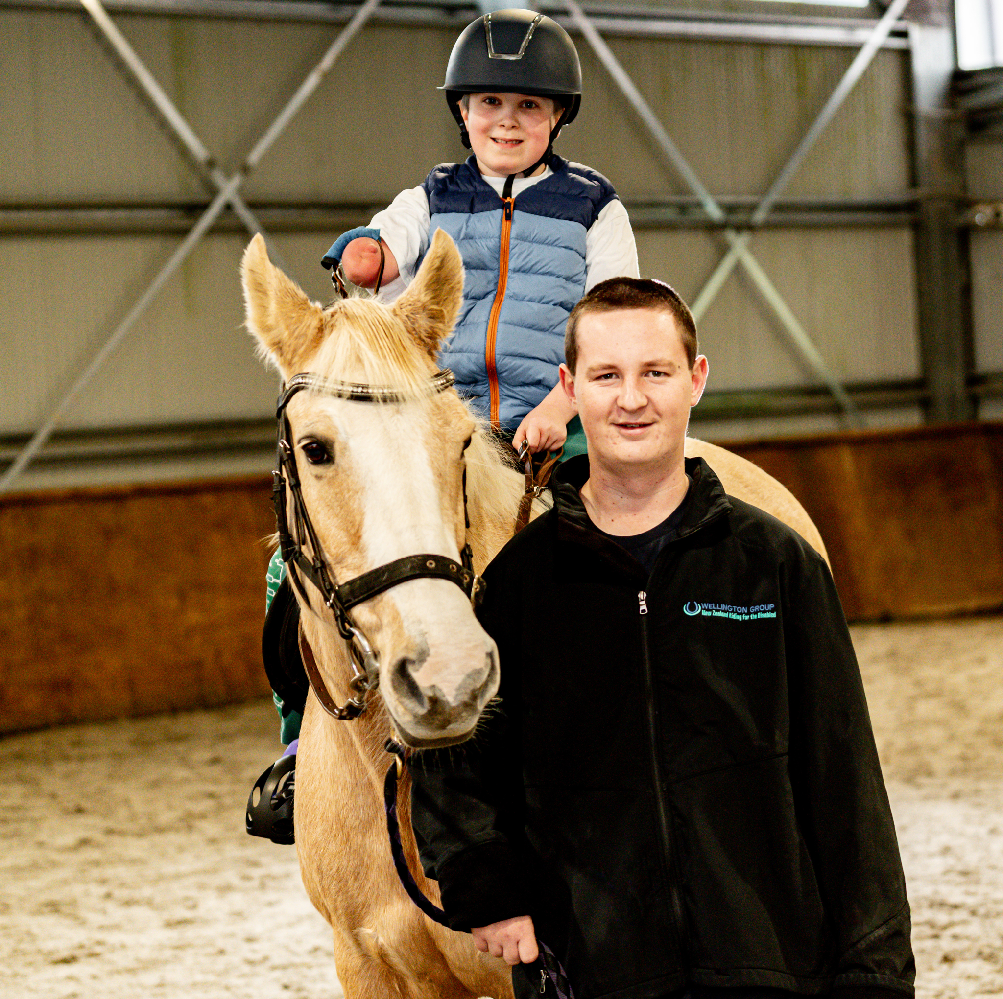 Jack's Story Jack riding a horse during a therapeutic horse riding session at NZ Riding for the Disabled.